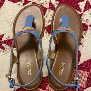 Women's Michael Kors Plate Flat Thong Sandals. In the color light blue. Size 8.